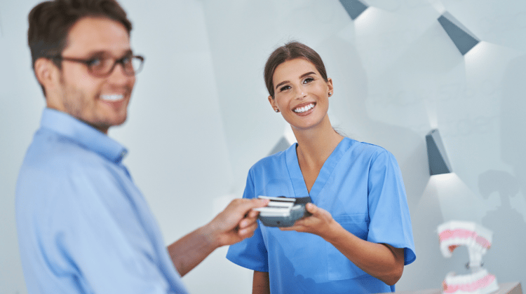 Patient Paying for Dental Visit