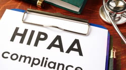 HIPAA Compliance Documents on Clipboard