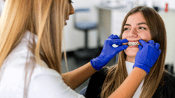 Orthodontist and Smiling Patient