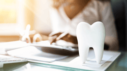 Dentist Checking Bill