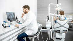 dentist on computer