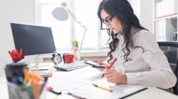 Dentist Working On Dental Practice Accounting Statements