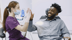 Dentist and Patient High-Fiving