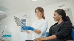 dentist using practice management software to help patient