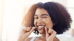 Woman flossing