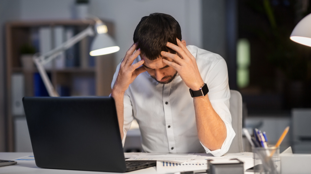 Stressed Man at Desktop