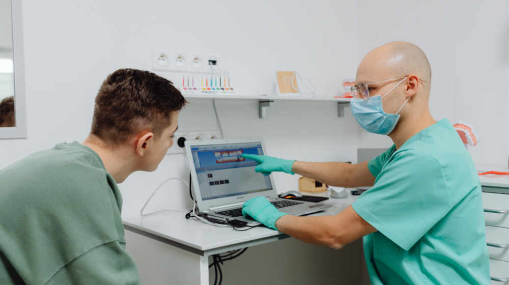 Dentist having conversation with patient