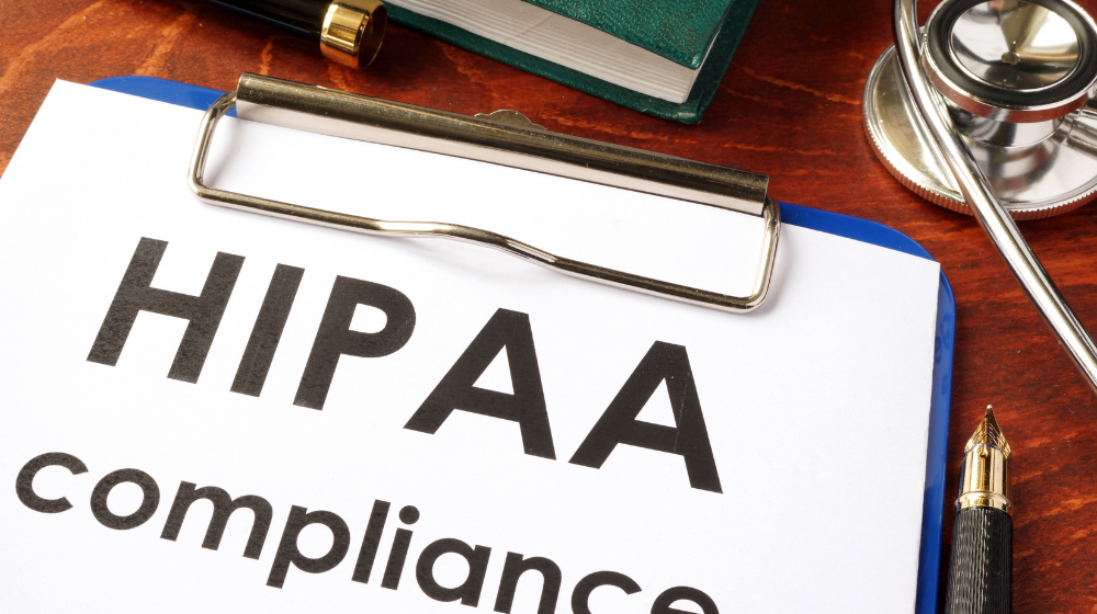 HIPAA Compliance Documents on Clipboard