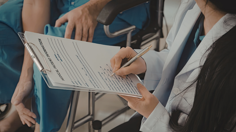 Dentist Reviewing a Dental Patient's Medical History Form on Clipboard