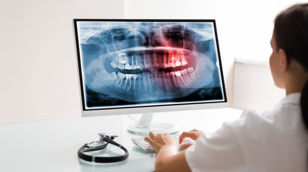 dentist looking at online dental technology