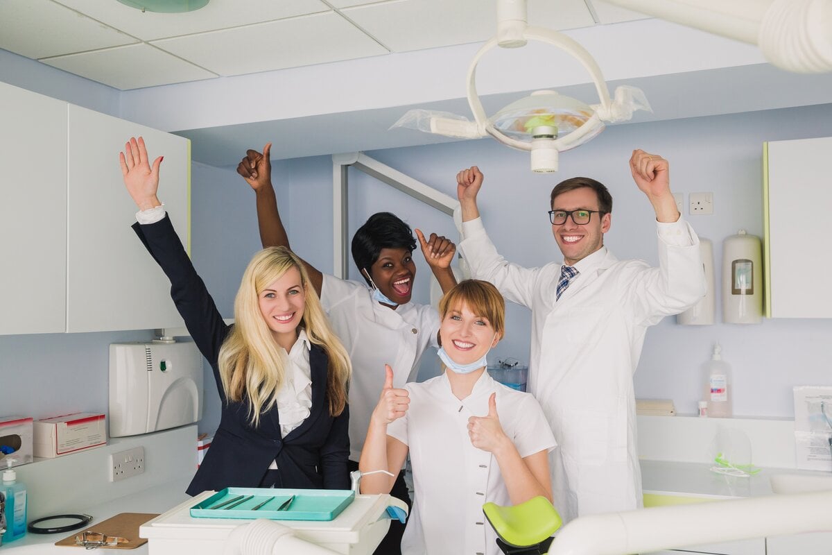 Dental Practice Staff Happy and Cheering Image